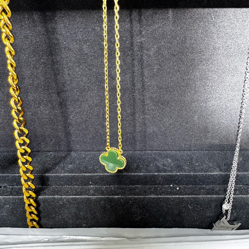 New gold color chain with green clover